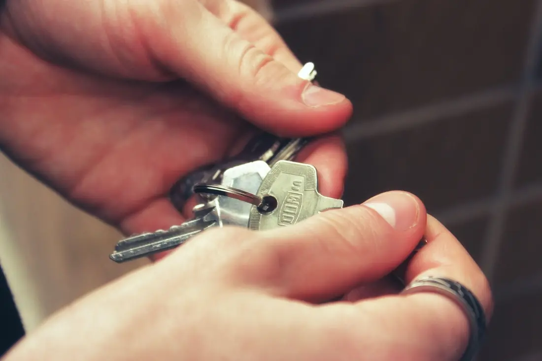 House keys passed from one hand to another