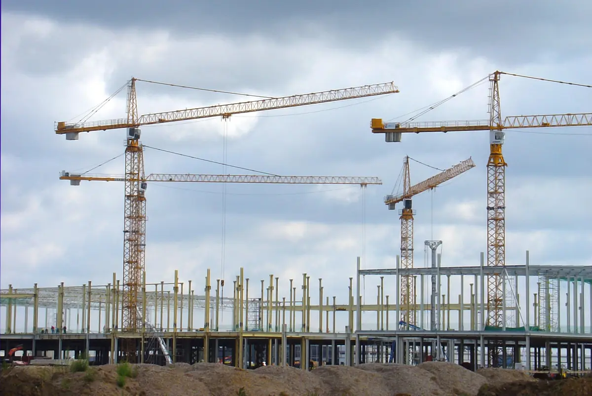 Tower cranes over a building under construction